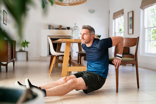 a middle-aged man doing stretches to prevent arthritis